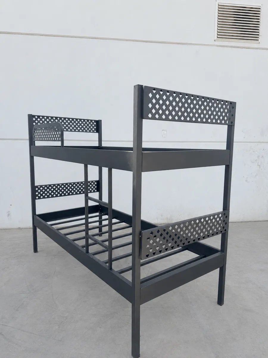 Demountable metal bunk bed stacked as a bunk