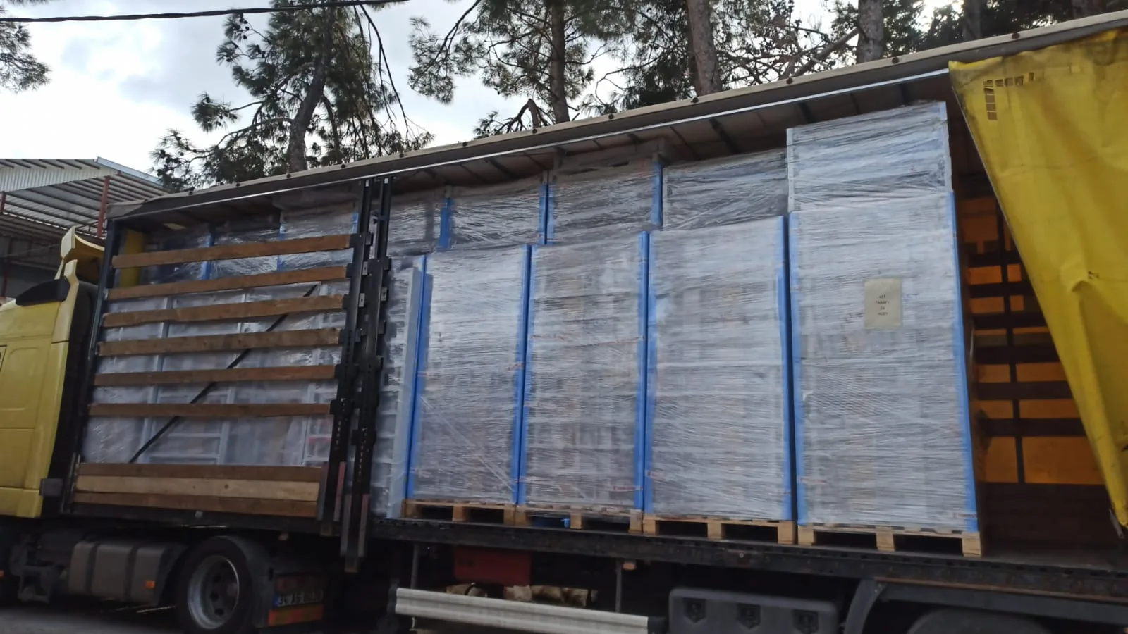 Stretch wrapped pallets of bunk beds loaded in a truck