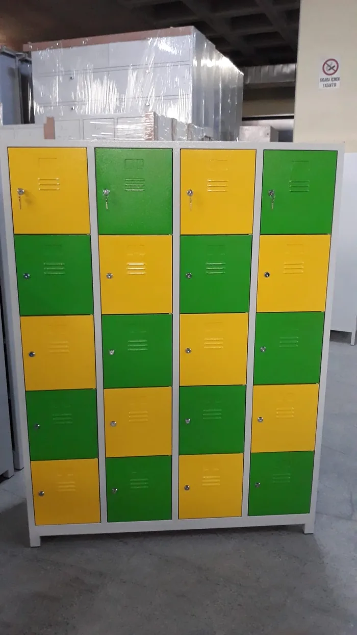 Twenty-compartment locker in four columns and five tiers, doors alternating yellow and green on a light gray body