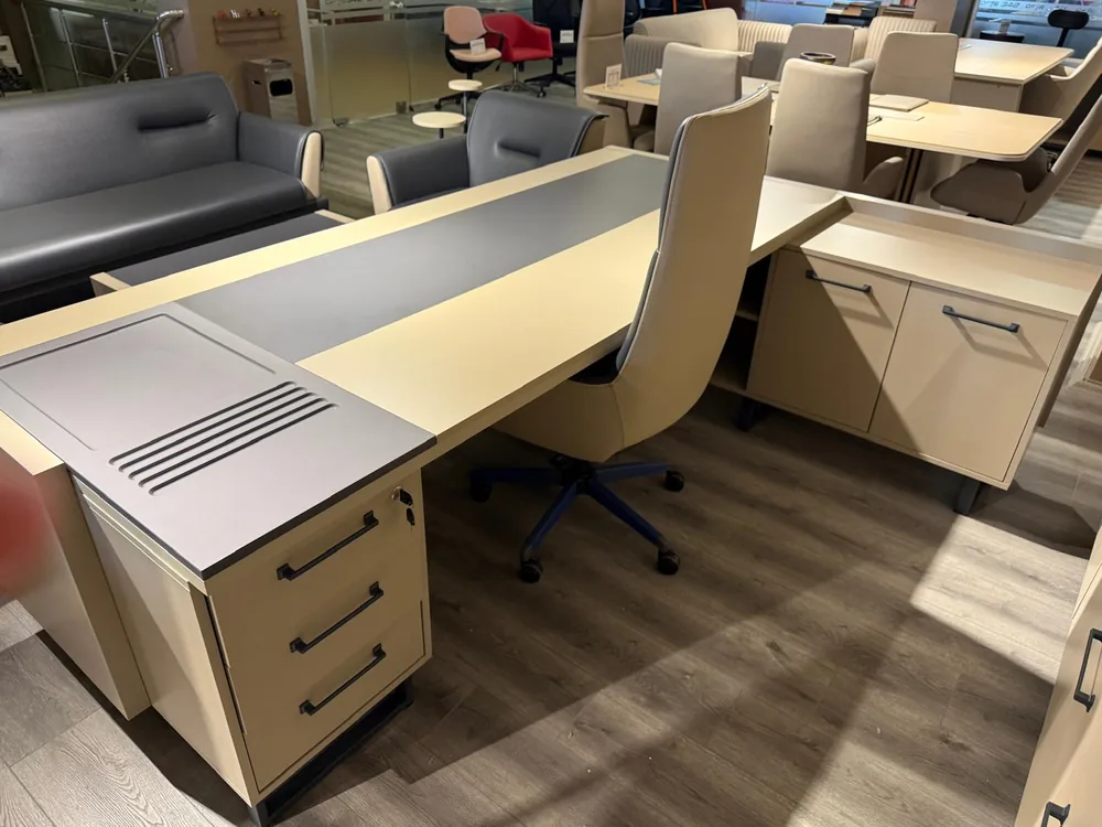 Desk top and side unit seen from behind, showing the drawer front and the lock
