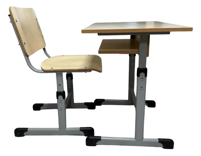 Height adjustable student desk and seat seen from the side, showing the adjustment collars and the book shelf