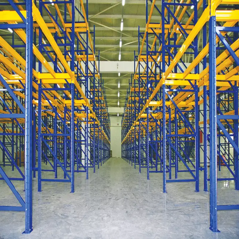 Warehouse aisle of blue and yellow pallet racking, empty and ready to load